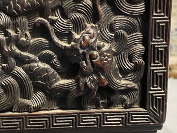 Un petit cabinet en bois sculpt&eacute; &agrave; d&eacute;cor de dragons, Chine, R&eacute;publique