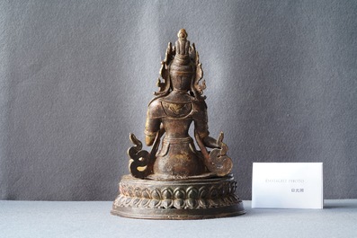 A Nepalese gilt bronze figure of White Tara, 16th C.