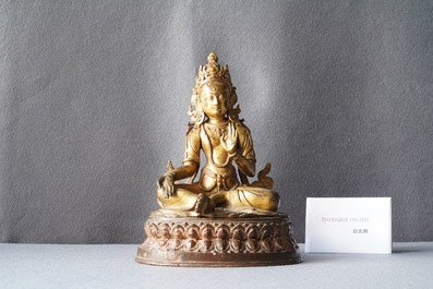 A Nepalese gilt bronze figure of White Tara, 16th C.