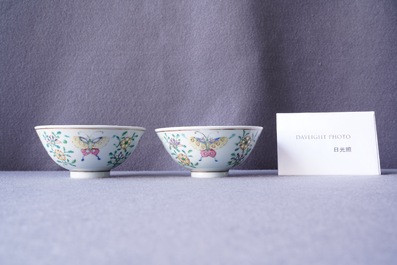 A pair of Chinese famille rose rice grain pattern 'butterfly' bowls, Qianlong mark, 18/19th C.