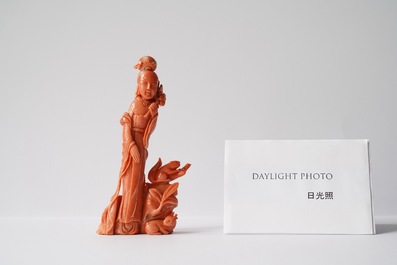 A Chinese carved red coral group of a lady, a squirrel and a rabbit, 19/20th C.