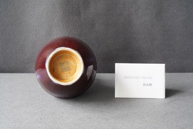 A Chinese monochrome flamb&eacute;-glazed vase, incised Qianlong mark, 18/19th C.