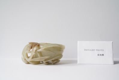 A Chinese mottled celadon and brown jade peach-form brush washer, Qing