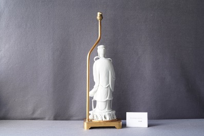A Chinese gilt bronze lamp-mounted blanc de Chine figure of Guanyin, 19/20th C.