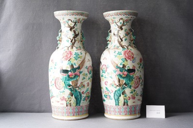A pair of Chinese famille rose vases with birds among blossoming branches, 19th C.