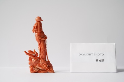 A Chinese carved red coral group of a lady, a squirrel and a rabbit, 19/20th C.