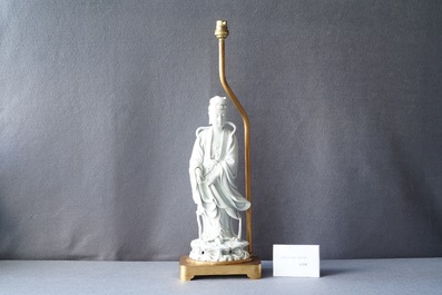 A Chinese gilt bronze lamp-mounted blanc de Chine figure of Guanyin, 19/20th C.