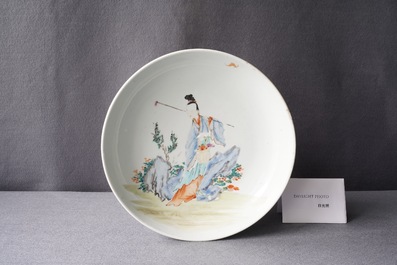 A Chinese famille rose dish with a lady in a landscape, Yongzheng