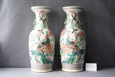 A pair of Chinese famille rose vases with birds among blossoming branches, 19th C.