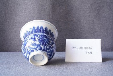 A Chinese blue and white 'lotus scroll' spittoon or zhadou, Kangxi