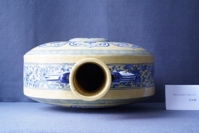 A Chinese yellow-ground blue and white 'Bajixiang' moon flask vase, Yongzheng mark, 19/20th C.