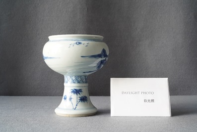 A Chinese blue and white stem cup with a continuous landscape scene, Kangxi/Yongzheng