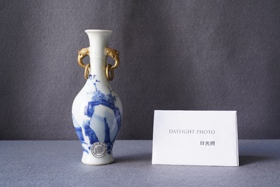 A Chinese blue and white vase with gilt elephant-head handles, Kangxi