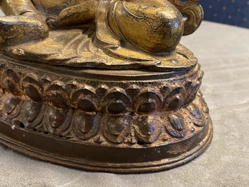 A Nepalese gilt bronze figure of White Tara, 16th C.