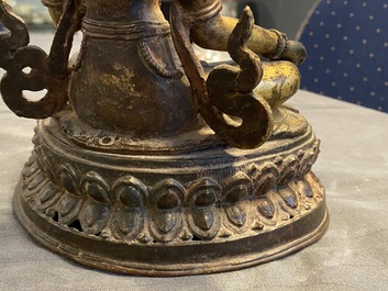 A Nepalese gilt bronze figure of White Tara, 16th C.