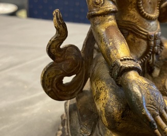 A Nepalese gilt bronze figure of White Tara, 16th C.