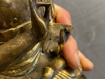 A Chinese gilt bronze figure of Buddha, 17th C.