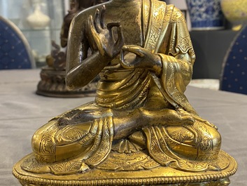 A Chinese gilt bronze figure of Buddha, 17th C.
