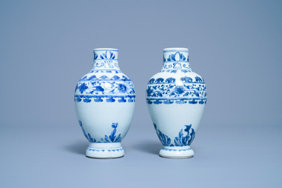 A pair of Chinese blue and white ewers, Transitional period