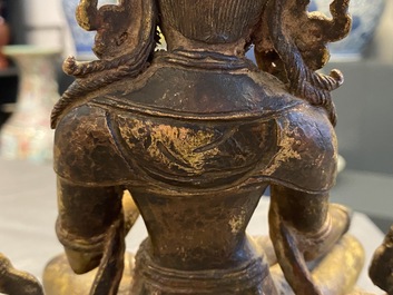 A Nepalese gilt bronze figure of White Tara, 16th C.