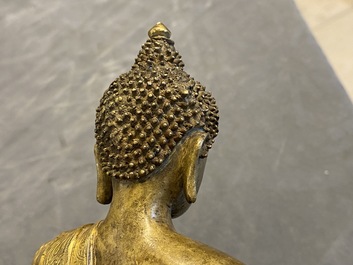 A Chinese gilt bronze figure of Buddha, 17th C.