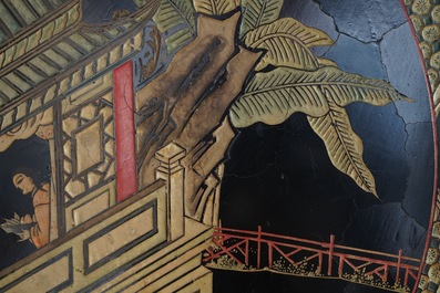 A massive Chinese carved wooden screen with a round famille verte plaque and polychrome lacquer, 19th C.