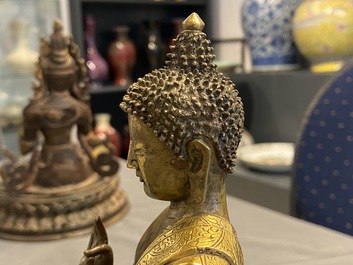 A Chinese gilt bronze figure of Buddha, 17th C.