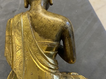 A Chinese gilt bronze figure of Buddha, 17th C.
