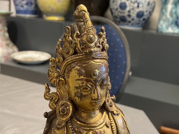 A Nepalese gilt bronze figure of White Tara, 16th C.
