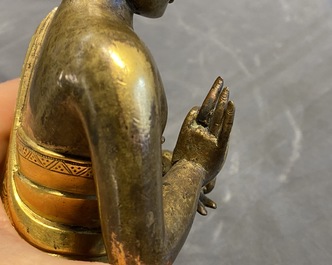 A Chinese gilt bronze figure of Buddha, 17th C.