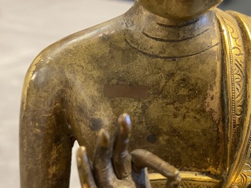 A Chinese gilt bronze figure of Buddha, 17th C.