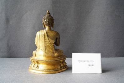A Chinese gilt bronze figure of Buddha, 17th C.
