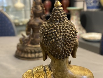 A Chinese gilt bronze figure of Buddha, 17th C.