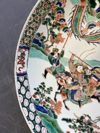 A Chinese famille verte dish with warriors on horseback, Kangxi