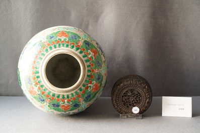 A large Chinese famille verte 'mythical beasts' jar with wooden cover, Kangxi