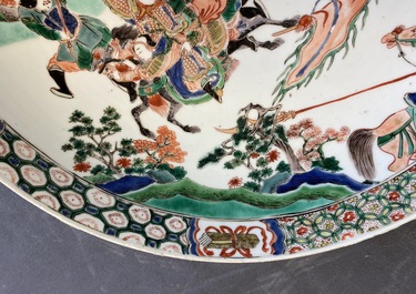 A Chinese famille verte dish with warriors on horseback, Kangxi