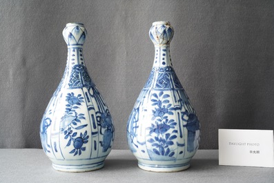 A pair of Chinese blue and white 'garlic head' bottle vases, Wanli