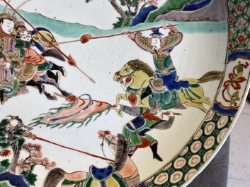 A Chinese famille verte dish with warriors on horseback, Kangxi