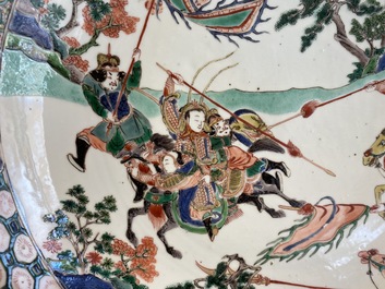 A Chinese famille verte dish with warriors on horseback, Kangxi