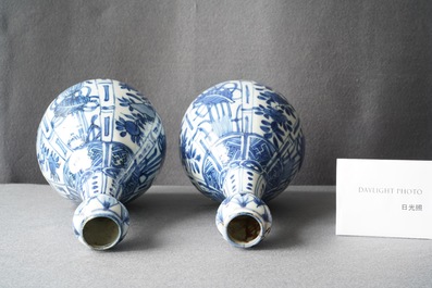 A pair of Chinese blue and white 'garlic head' bottle vases, Wanli