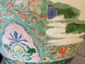A large Chinese famille verte 'mythical beasts' jar with wooden cover, Kangxi