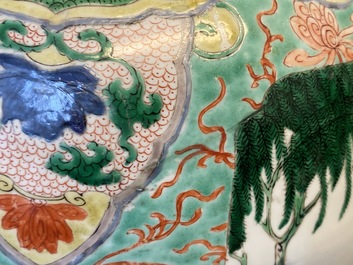 A large Chinese famille verte 'mythical beasts' jar with wooden cover, Kangxi