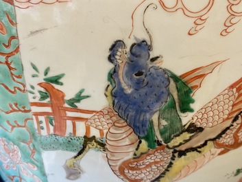 A large Chinese famille verte 'mythical beasts' jar with wooden cover, Kangxi