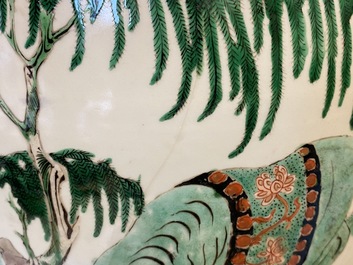 A large Chinese famille verte 'mythical beasts' jar with wooden cover, Kangxi