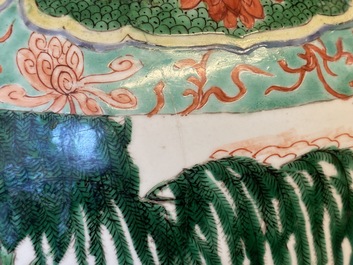A large Chinese famille verte 'mythical beasts' jar with wooden cover, Kangxi