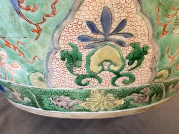 A large Chinese famille verte 'mythical beasts' jar with wooden cover, Kangxi