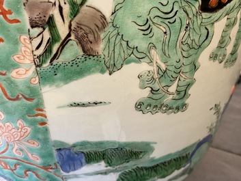 A large Chinese famille verte 'mythical beasts' jar with wooden cover, Kangxi