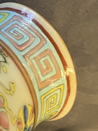 A Chinese famille rose double gourd 'antiquities' vase, 19th C.