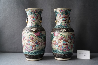 A pair of Chinese Nanking famille rose crackle-glazed 'warrior' vases, 19th C.
