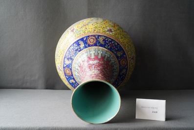 A large Chinese yellow-ground famille rose 'dragon and phoenix' bottle vase, 19th C.